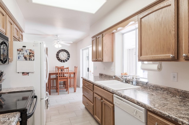 kitchen with ceiling fan, sink, and black appliances