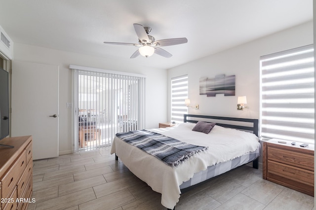 bedroom featuring ceiling fan and access to outside