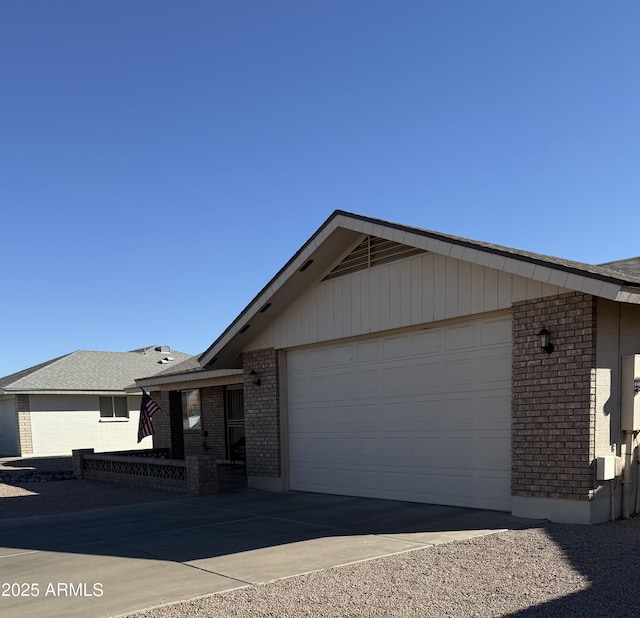 ranch-style home featuring a garage