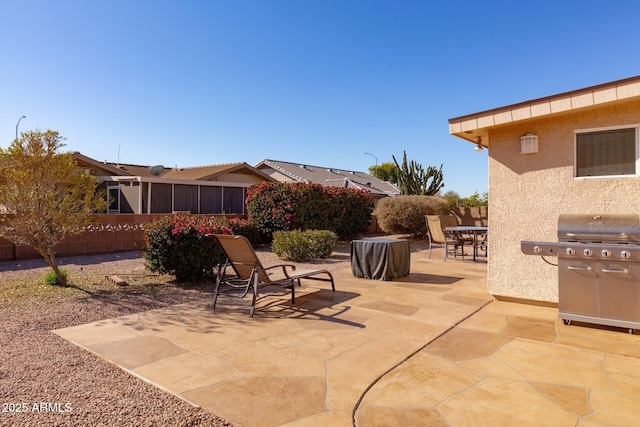 view of patio featuring a grill