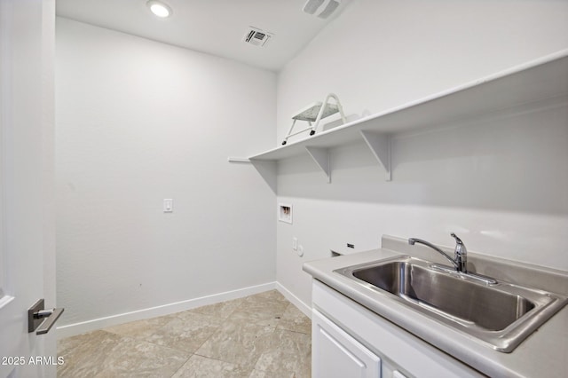 washroom with washer hookup, cabinets, and sink