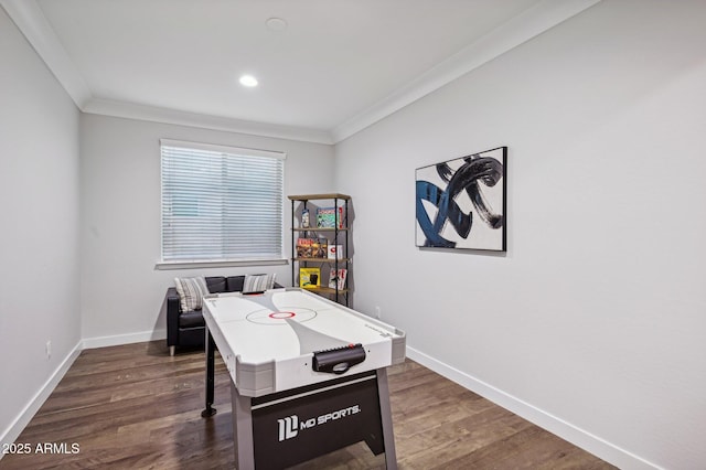 playroom featuring dark hardwood / wood-style floors and crown molding