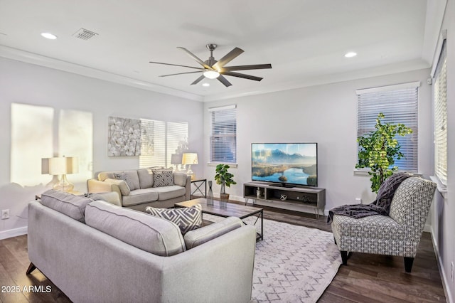 living room featuring ceiling fan, dark hardwood / wood-style floors, and ornamental molding