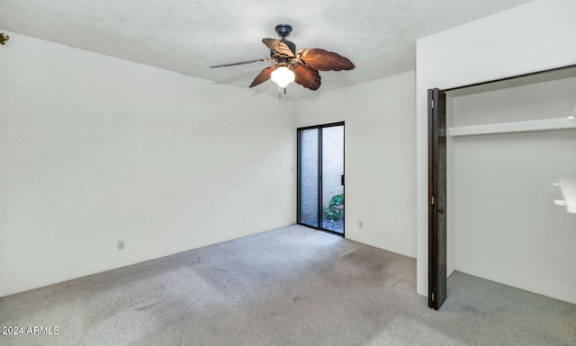 unfurnished bedroom featuring ceiling fan, light colored carpet, and a closet