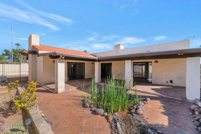 rear view of house with a patio