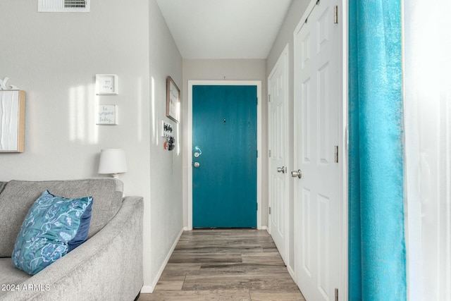 doorway to outside featuring hardwood / wood-style flooring