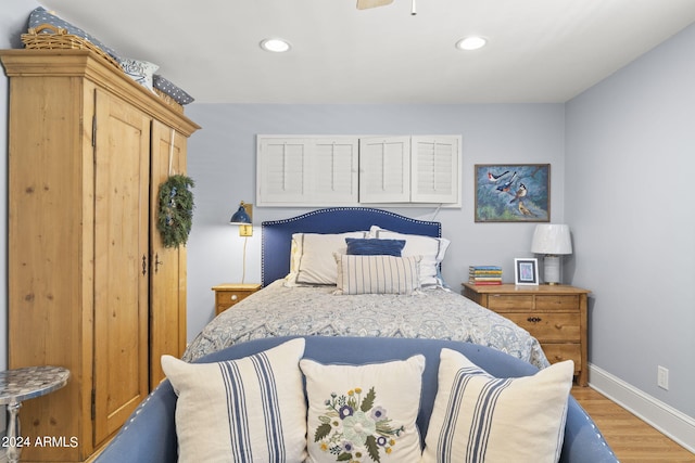 bedroom with hardwood / wood-style flooring