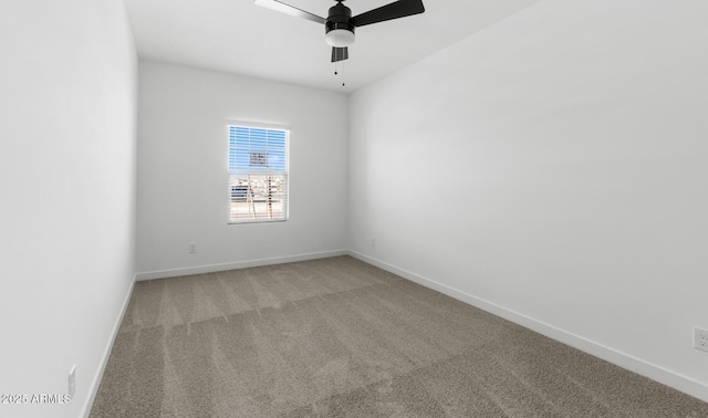 spare room with carpet and ceiling fan