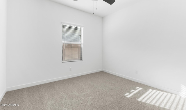 spare room with ceiling fan and carpet flooring