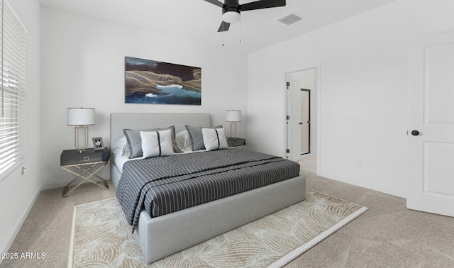 bedroom with light colored carpet and ceiling fan