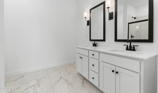 bathroom with vanity and a shower with shower door