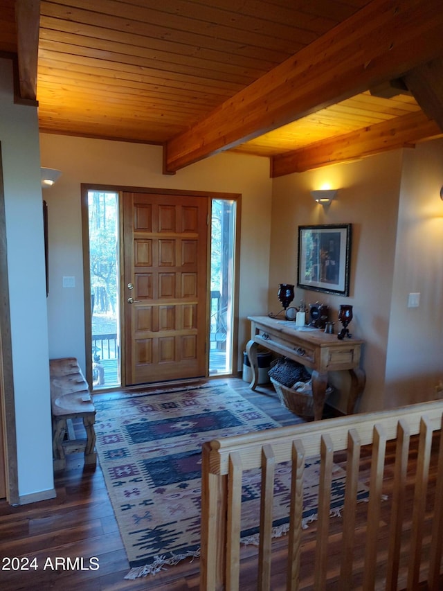 foyer entrance with dark wood-type flooring, beamed ceiling, and wooden ceiling