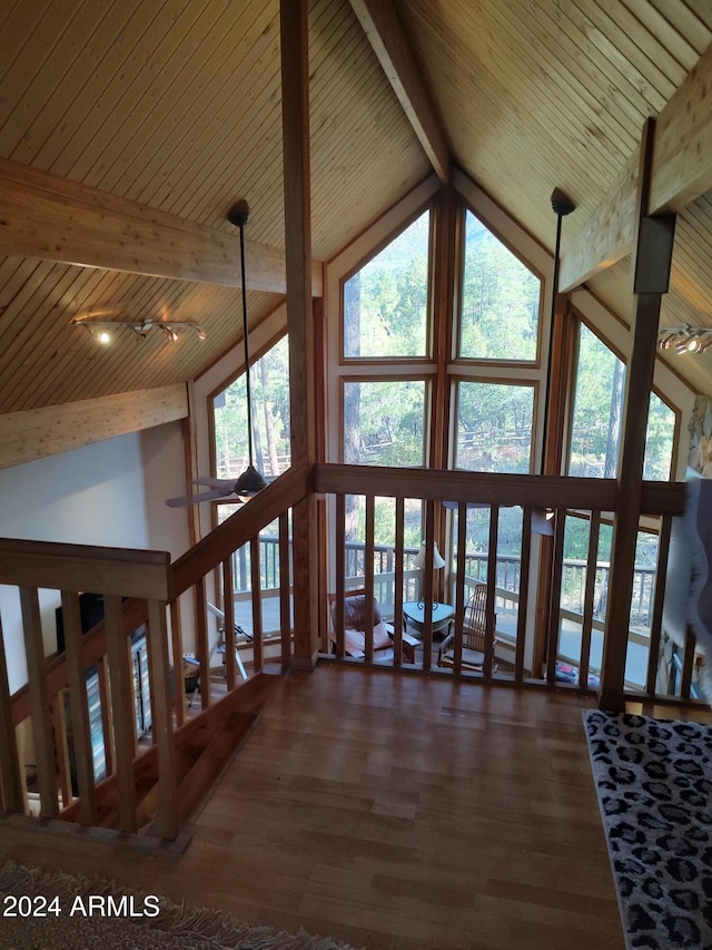 interior space with wood ceiling, high vaulted ceiling, beamed ceiling, and dark hardwood / wood-style floors