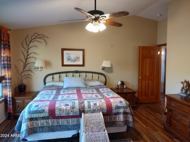 bedroom with dark hardwood / wood-style flooring, vaulted ceiling, and ceiling fan