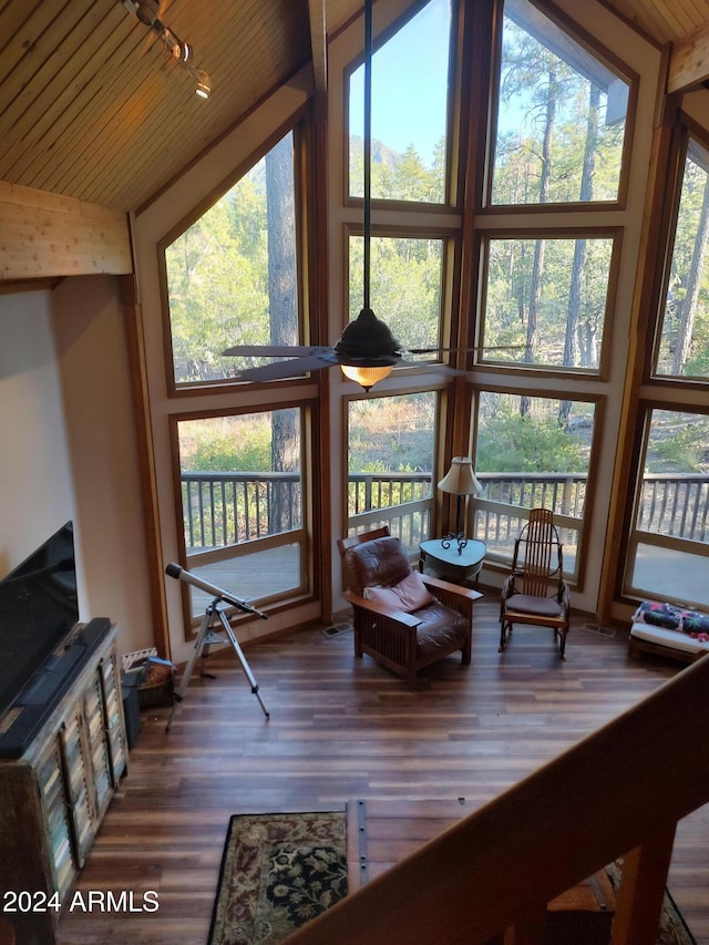 living room with dark wood-type flooring, high vaulted ceiling, and wooden ceiling