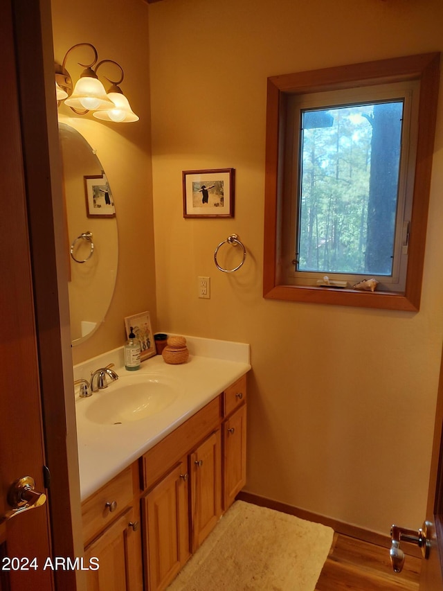 bathroom with vanity and hardwood / wood-style floors