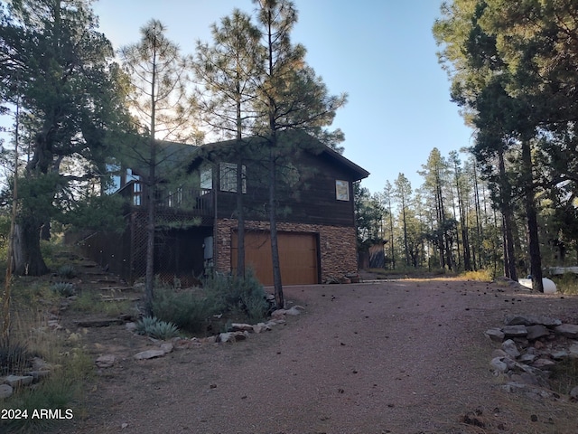 view of property exterior featuring a garage