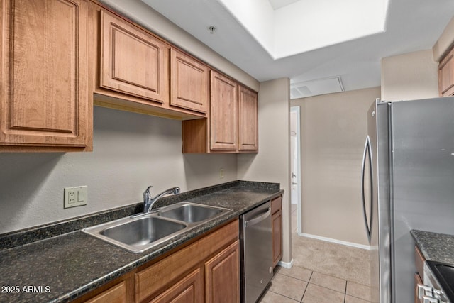 3434 E Baseline Rd Unit 126, Phoenix, AZ 85042 - kitchen featuring appliances with stainless steel finishes, brown cabinetry, and light tile patterned floors