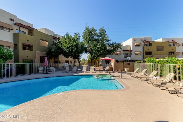 3434 E Baseline Rd Unit 126, Phoenix, AZ 85042 - view of swimming pool featuring a pool with connected hot tub and a patio