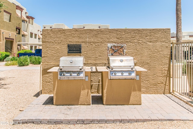 3434 E Baseline Rd Unit 126, Phoenix, AZ 85042 - view of patio featuring an outdoor kitchen