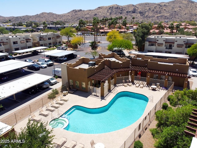 3434 E Baseline Rd Unit 126, Phoenix, AZ 85042 - view of swimming pool featuring a mountain view, a pool with connected hot tub, a patio area, and a residential view
