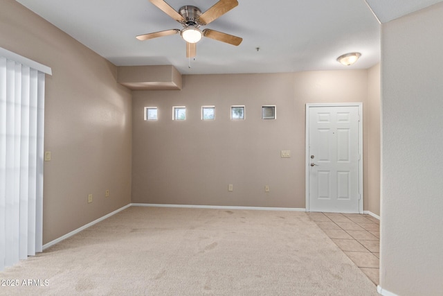 3434 E Baseline Rd Unit 126, Phoenix, AZ 85042 - empty room with ceiling fan, light colored carpet, and light tile patterned floors