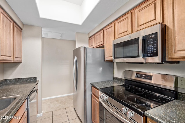 3434 E Baseline Rd Unit 126, Phoenix, AZ 85042 - kitchen featuring stainless steel appliances and light tile patterned flooring
