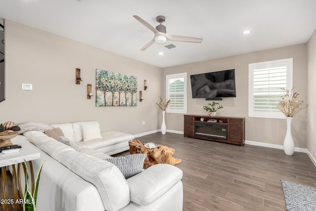 1297 W Chillingham Rd W, San Tan Valley, AZ 85143 - living room with ceiling fan, baseboards, wood finished floors, and recessed lighting