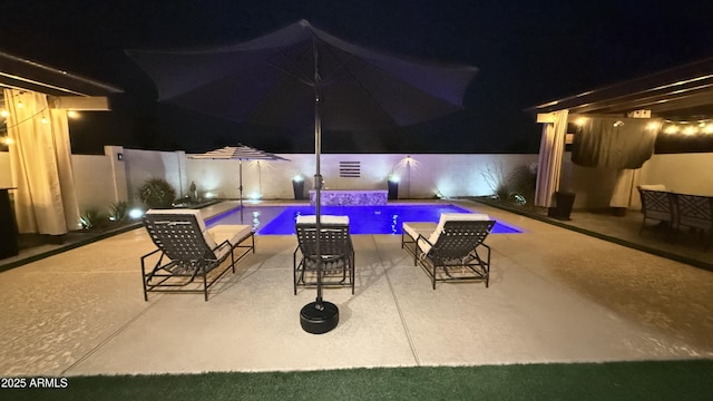 1297 W Chillingham Rd W, San Tan Valley, AZ 85143 - pool at twilight featuring a patio and a fenced backyard