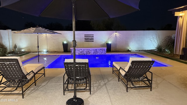 1297 W Chillingham Rd W, San Tan Valley, AZ 85143 - pool at twilight with a patio