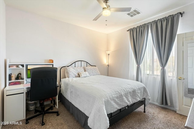 bedroom with a ceiling fan, light colored carpet, and visible vents