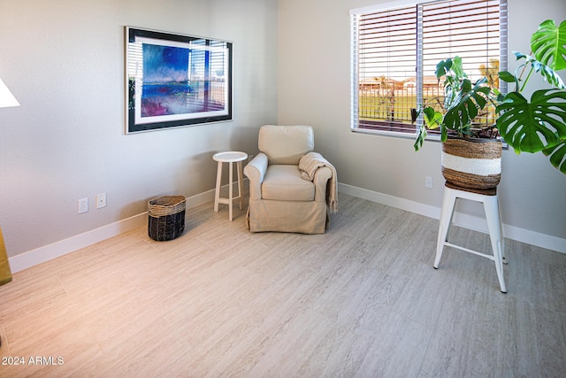 sitting room with light hardwood / wood-style floors