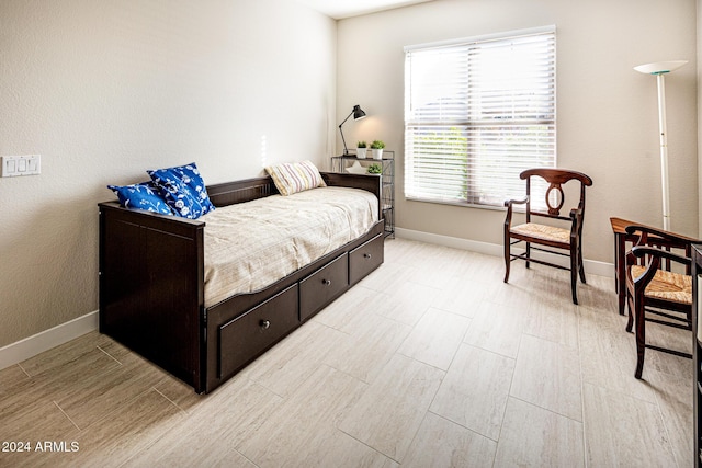 bedroom with light wood-type flooring