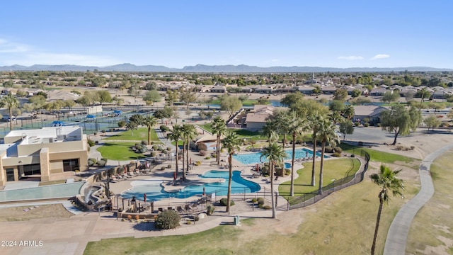 birds eye view of property with a mountain view