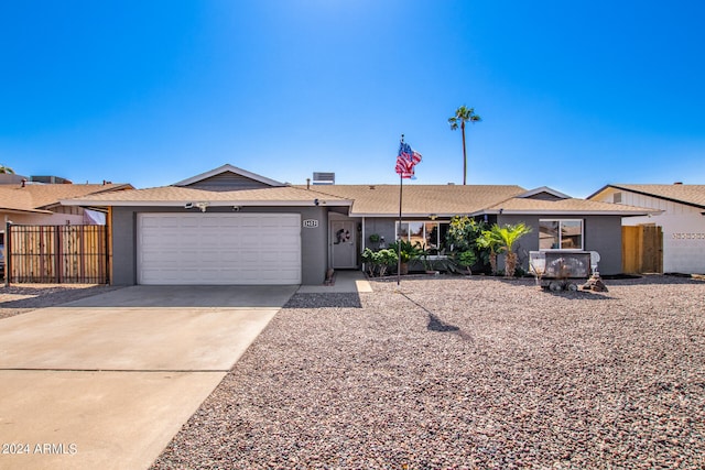 ranch-style home featuring a garage