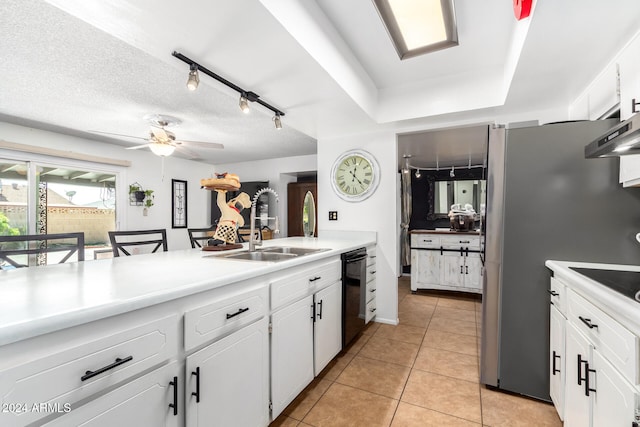 kitchen with ceiling fan, white cabinetry, sink, and light tile patterned floors