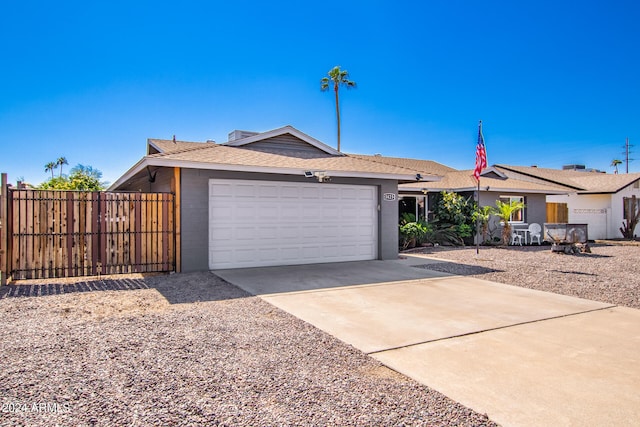 ranch-style home featuring a garage