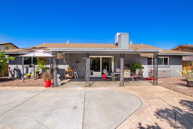 rear view of property with a patio area