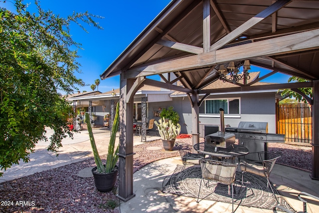 view of patio / terrace with grilling area and a gazebo