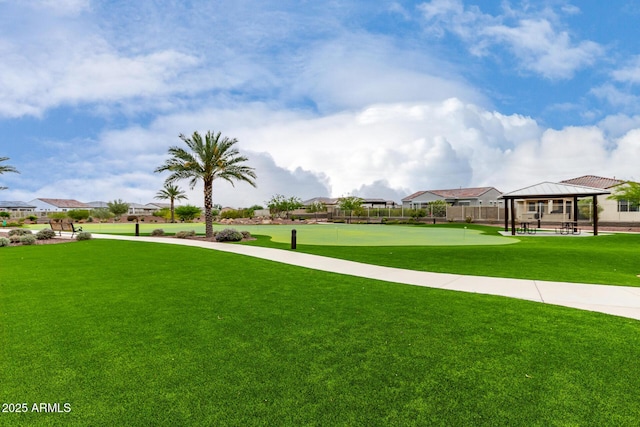18076 W Redwood Ln, Goodyear, AZ 85338 - view of home's community with a gazebo, an area to practice putting, and a residential view