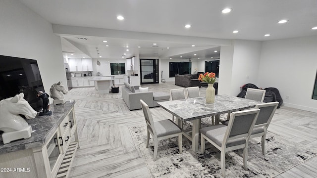 dining area featuring light parquet floors