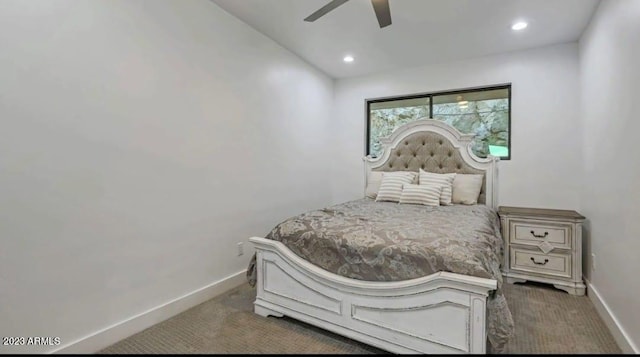 bedroom with dark colored carpet and ceiling fan