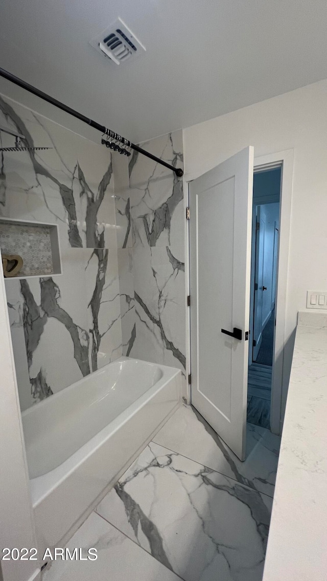 bathroom with shower / bathing tub combination