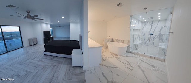 bathroom featuring ceiling fan and independent shower and bath