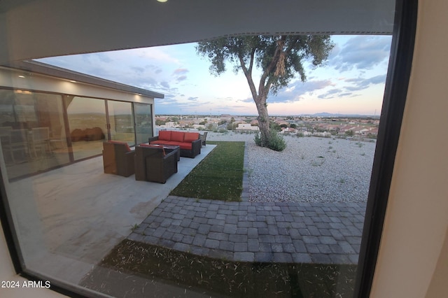 patio terrace at dusk with an outdoor living space