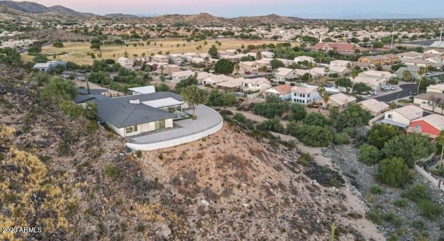 birds eye view of property with a mountain view