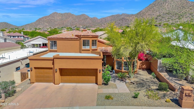 13914 E Laurel Ln, Scottsdale, AZ 85259 - view of front facade featuring fence, concrete driveway, stucco siding, a mountain view, and a garage