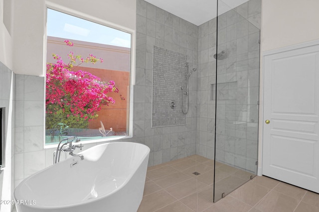 13914 E Laurel Ln, Scottsdale, AZ 85259 - bathroom with a soaking tub, walk in shower, and tile patterned flooring