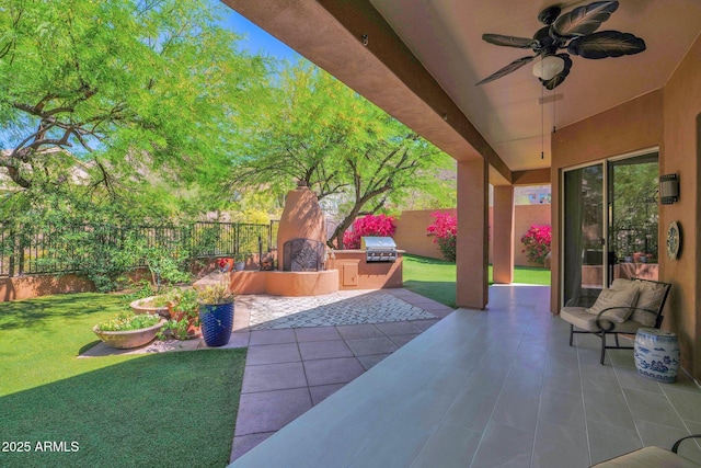 13914 E Laurel Ln, Scottsdale, AZ 85259 - view of patio / terrace with a fenced backyard, a grill, an outdoor kitchen, and a ceiling fan