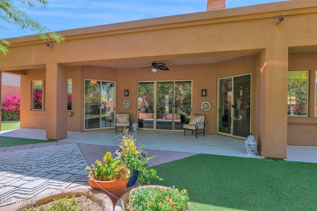 13914 E Laurel Ln, Scottsdale, AZ 85259 - back of house featuring a ceiling fan, a patio, and stucco siding